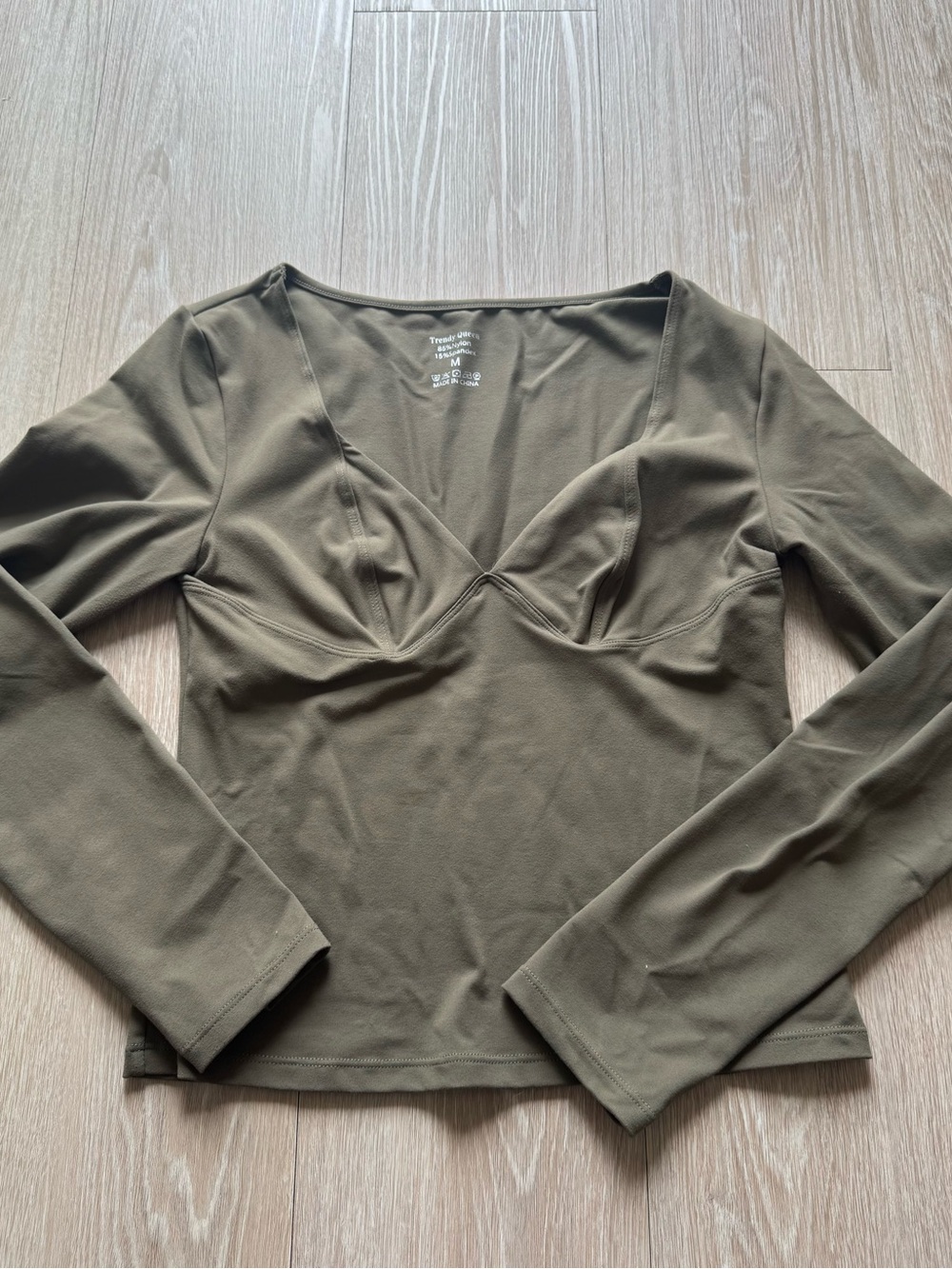 Long Sleeve V‑Neck Bust Detail Top in Olive Green